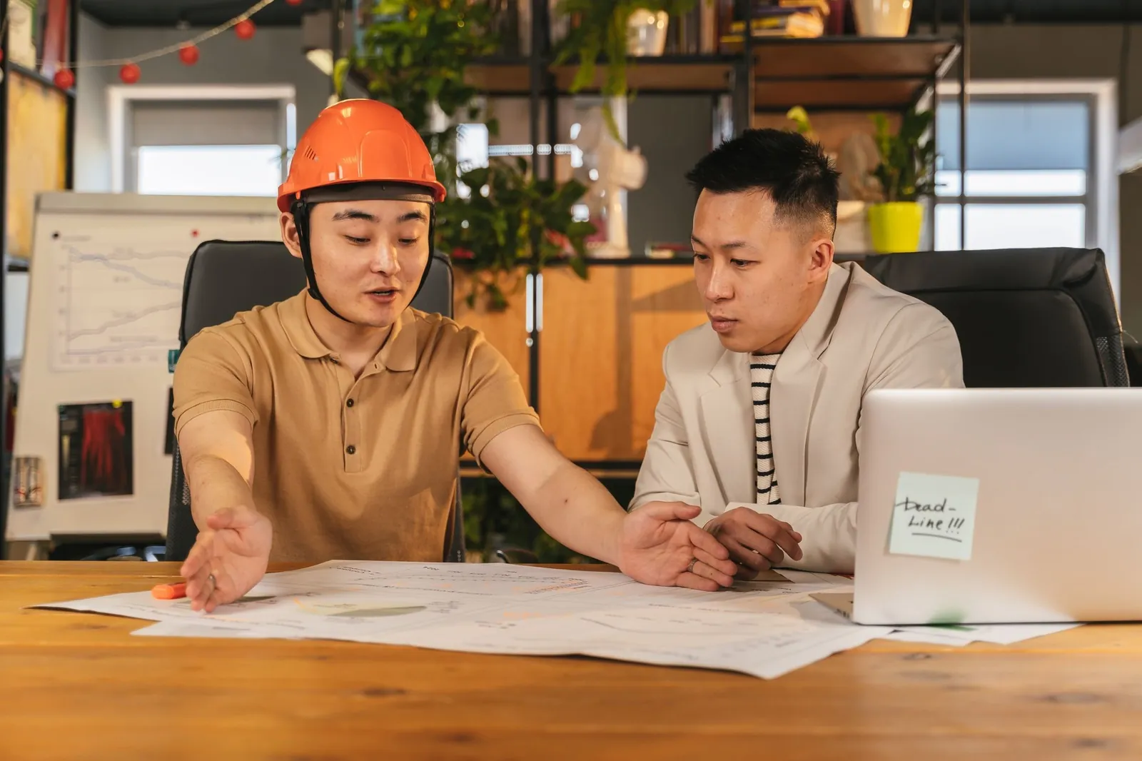 Two architects reviewing a plan before anything is built