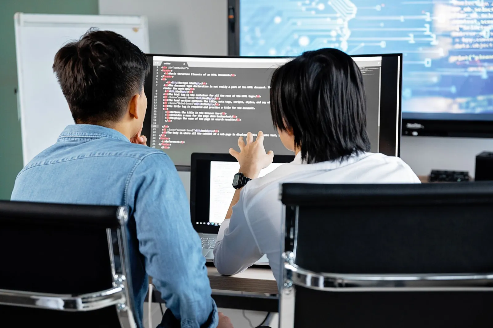 A Webist-managed team reviewing work together at one screen