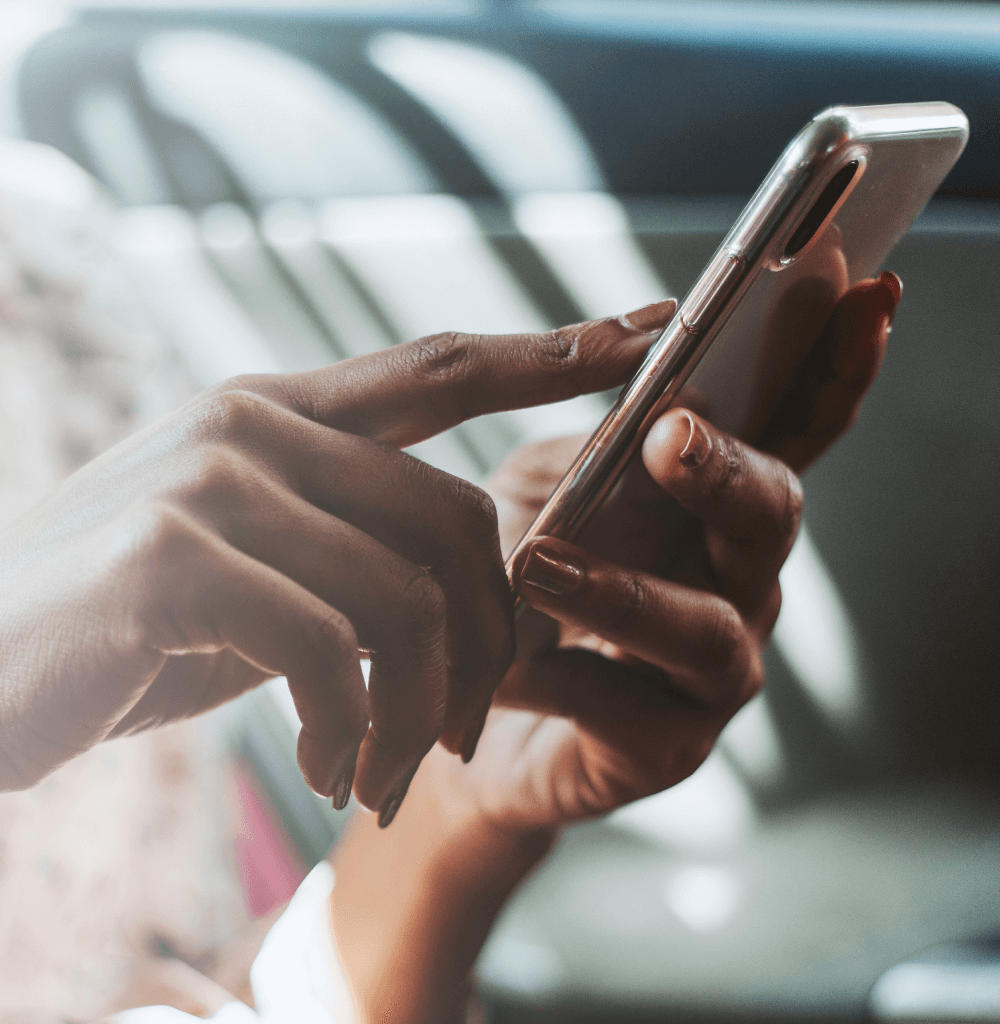 woman-using-phone-car
